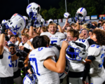 St. Xavier football players celebrate after defeating Elder in Week 6.