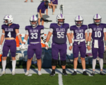 Elder High School football team captains take the field during the 2026 season.