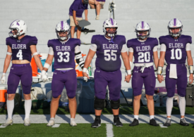 Elder High School football team captains take the field during the 2026 season.