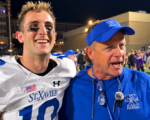 St. Xavier quarterback Thomas George and head coach Steve Specht celebrate after the Bombers' 31-29 win over Elder.